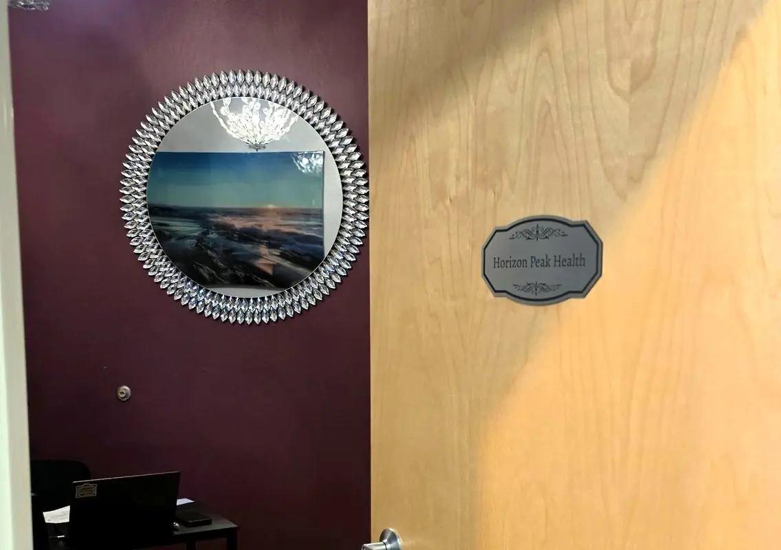 The Horizon Peak Health door sign at the Gilbert office, Suite 310